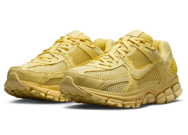 an image of gold nike vomero sneakers